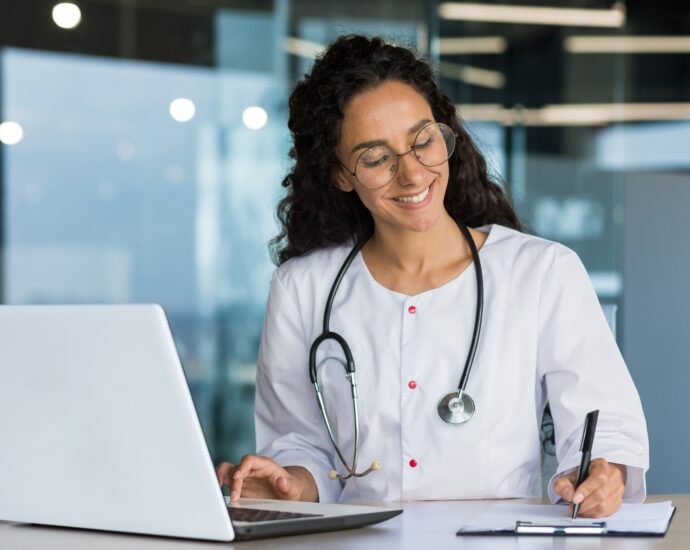 Online training. Young Latin American girl student doctor studies online at home from laptop